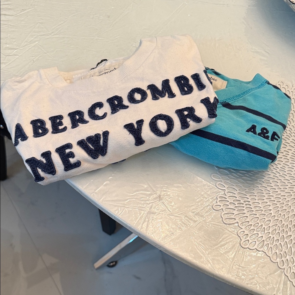 Abercrombie & Fitch White and Blue Short Sleeve Tees. Both for $25